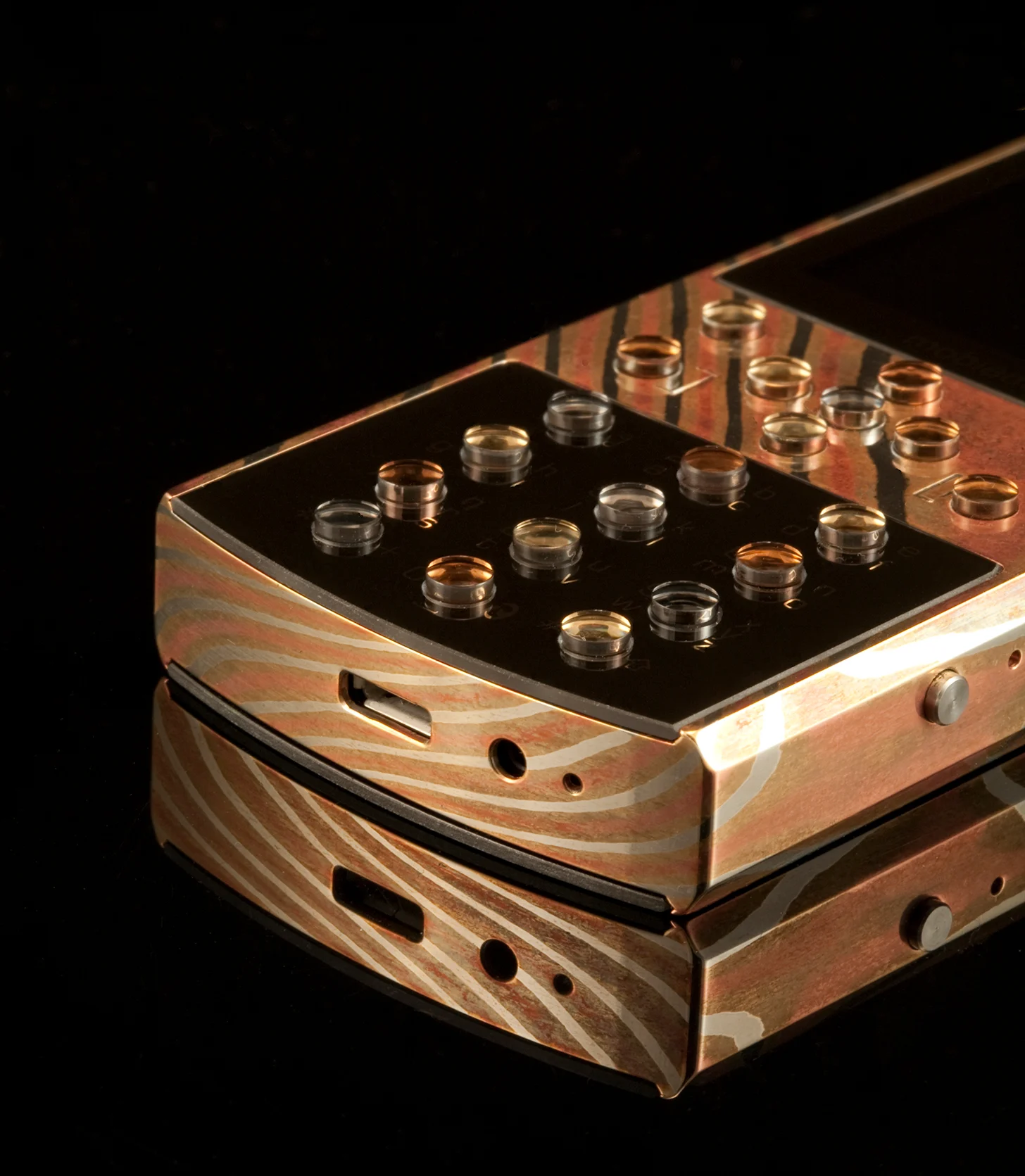 The layered metal grain and sculpted keypad of the Classic 712 MG.