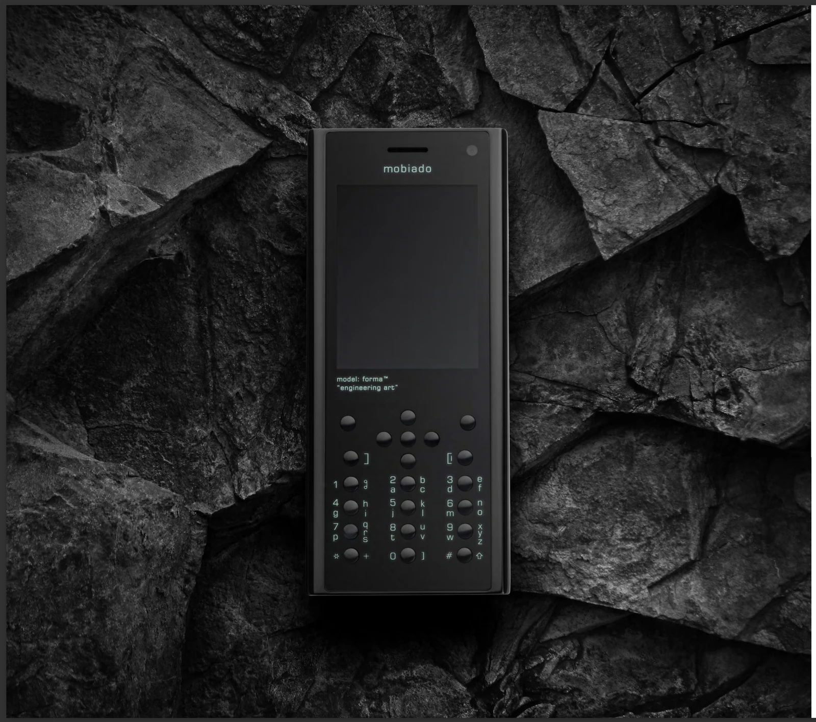 Forma Stealth resting on dark, fractured stone.