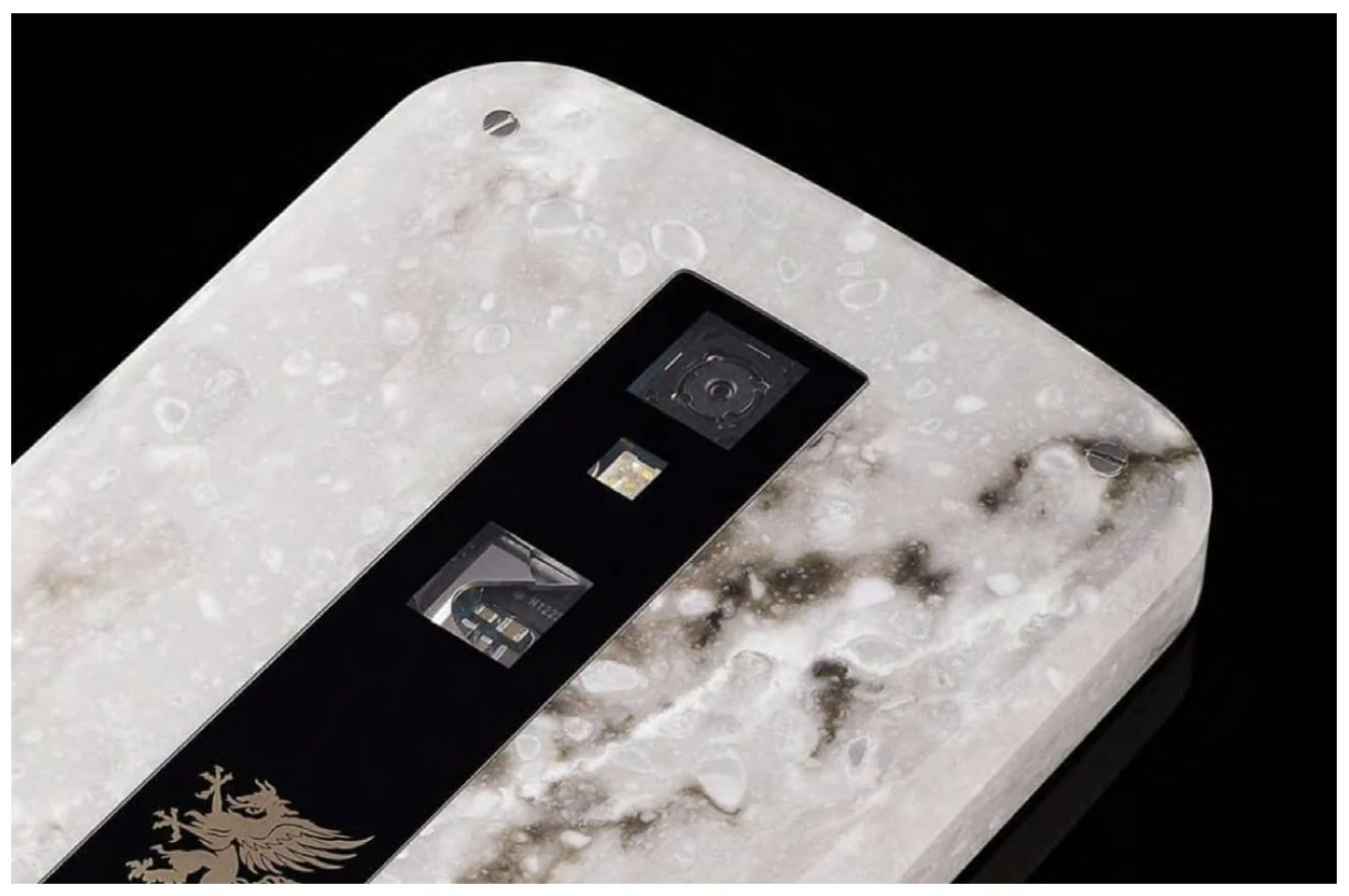 Corian and sapphire on the back of Grand EM – Marble, with the camera and SIM mechanism visible through the sapphire plate.