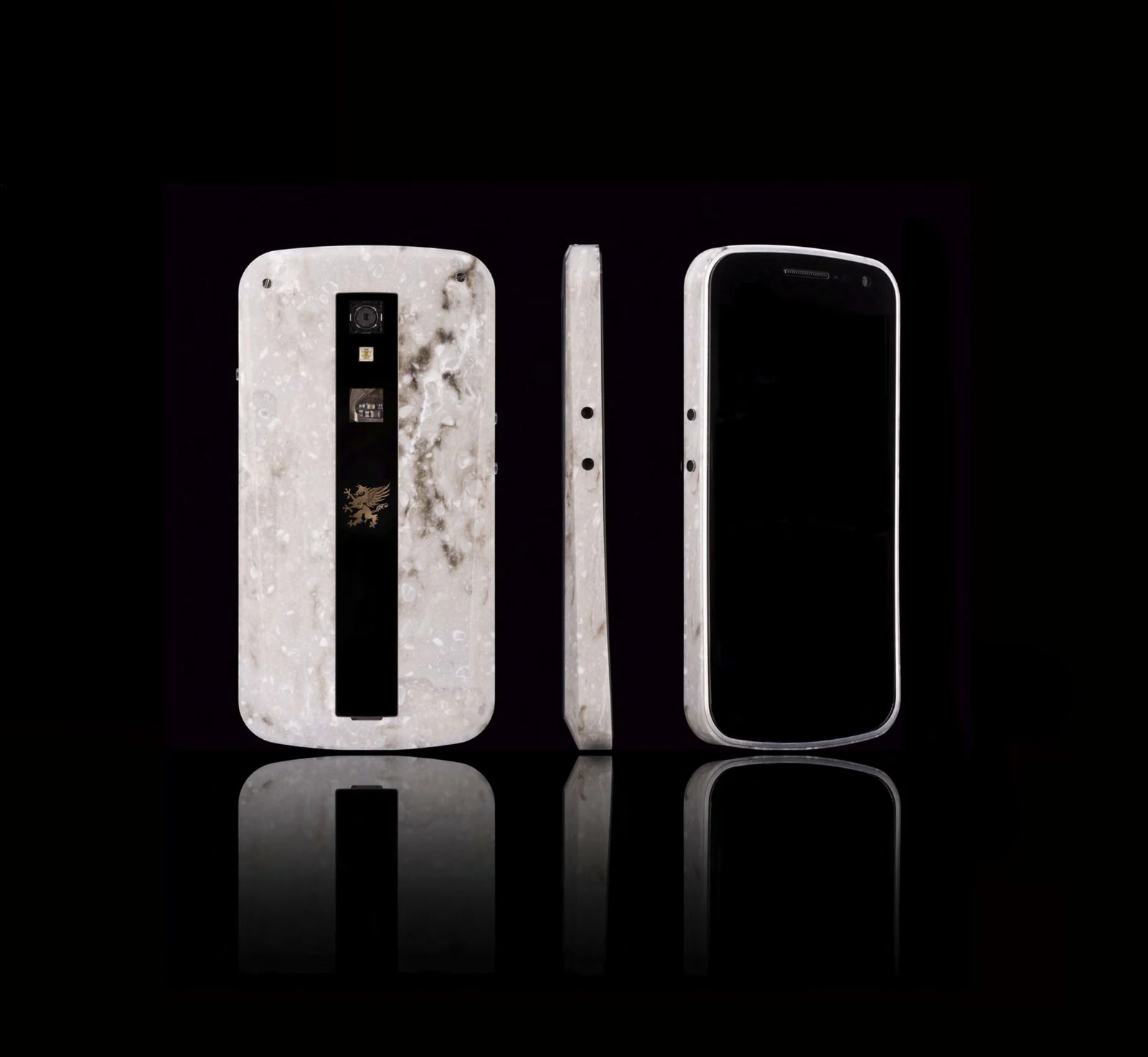The front and back of Grand EM – Marble, reflected against a black background.