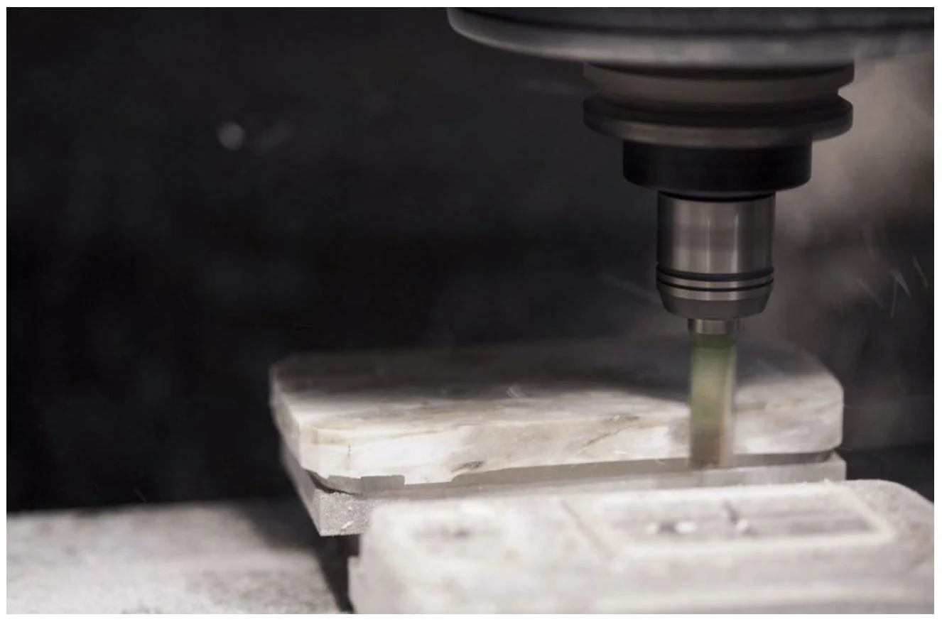 A milling cutter shaping the Corian and aluminium composite for Grand EM.